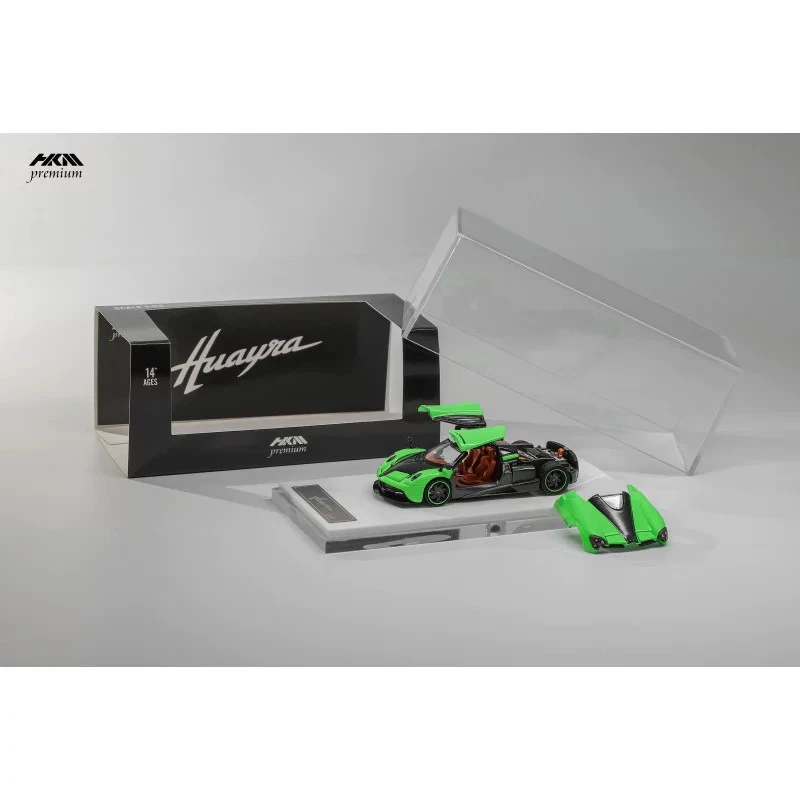 Green HKM Pagani Huayra Coupe die-cast model with openable panels, display base, and presentation box