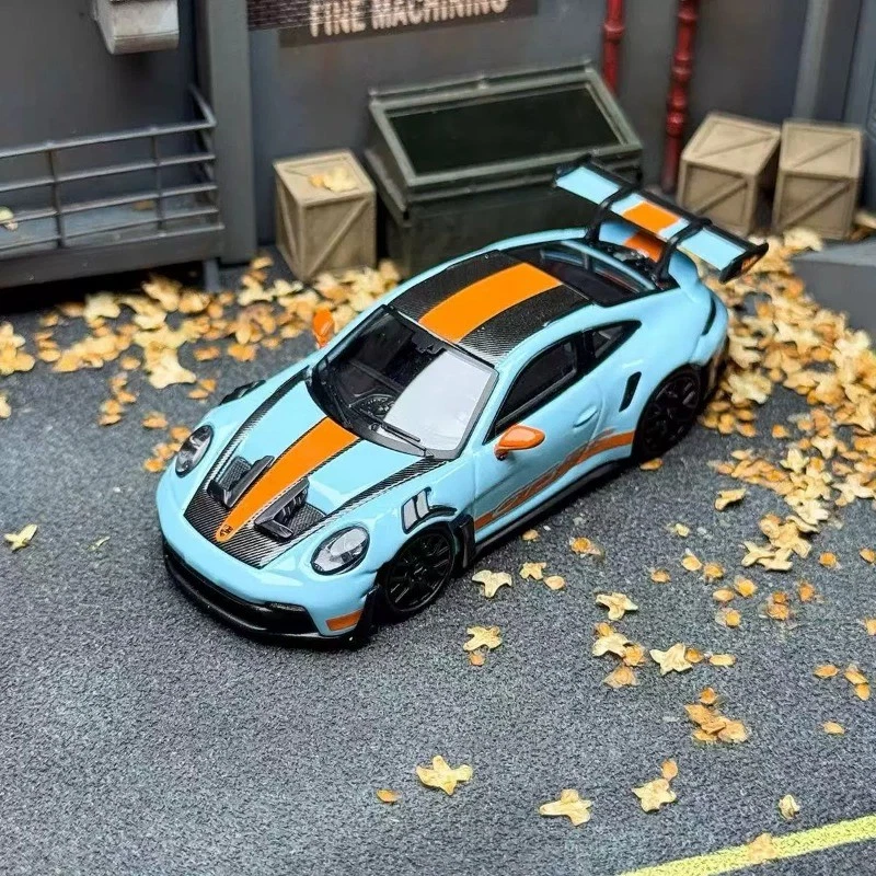 Light blue Street Warrior Porsche 911 GT3 RS with orange center stripe and black wheels