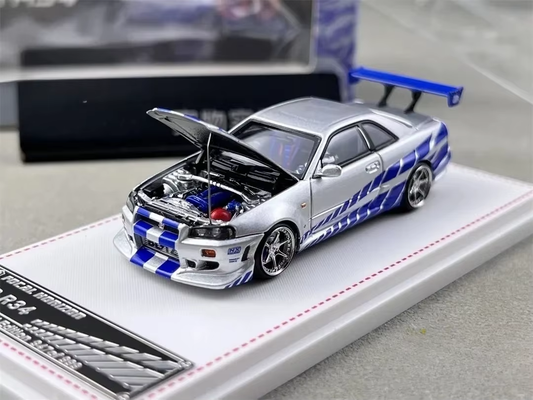 Silver and blue Focal Horizon Nissan Skyline GT-R R34 C-West die-cast model with hood open