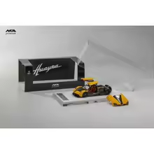 Yellow HKM Pagani Huayra Coupe die-cast model with display base and HKM packaging