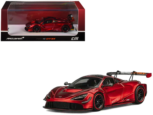 Red metallic McLaren 720S GT3X model with dark wheels and large rear wing in its display box