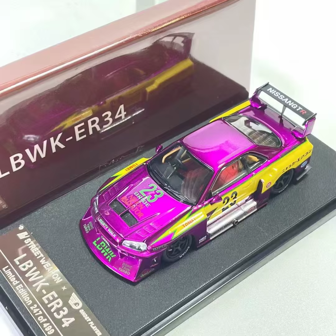 Purple and yellow Street Weapon LBWK Nissan Skyline ER34 #23 die-cast on display base with case